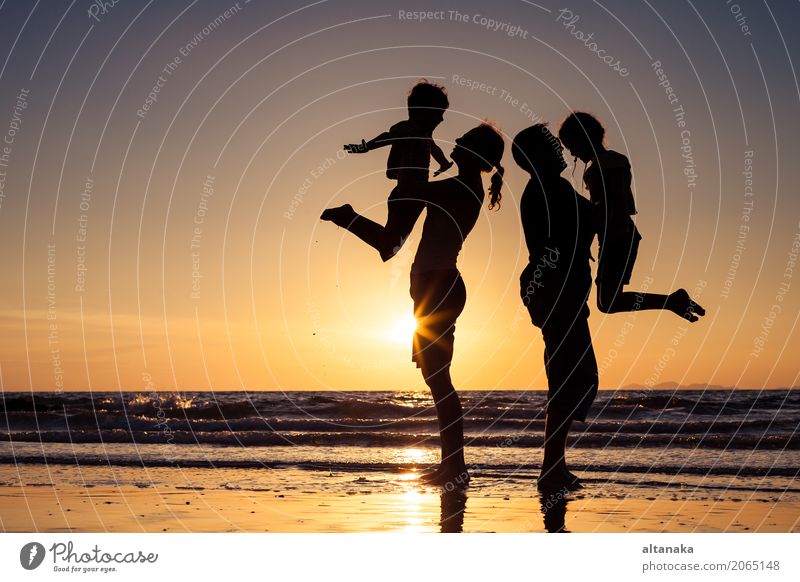 Silhouette of happy family Lifestyle Joy Leisure and hobbies Playing Vacation & Travel Trip Adventure Freedom Summer Sun Beach Ocean Sports Child Boy (child)