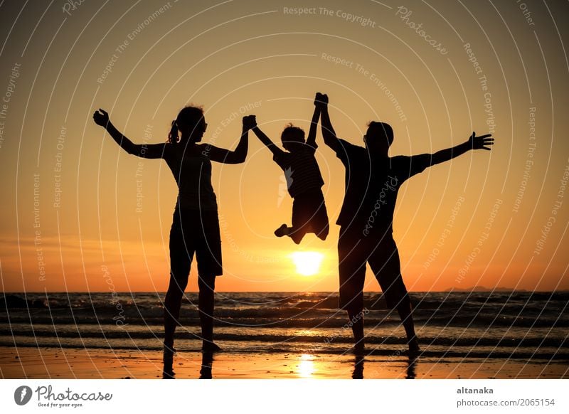 Silhouette of happy family Lifestyle Joy Leisure and hobbies Playing Vacation & Travel Trip Adventure Freedom Summer Sun Beach Ocean Sports Child Boy (child)