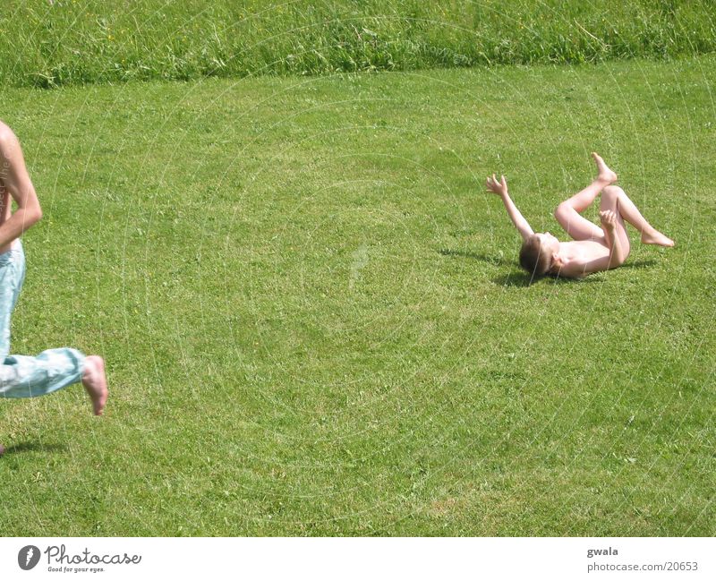 race Colour photo Exterior shot Day Sunlight Motion blur Child Human being Boy (child) Infancy 2 Nature Summer Grass Garden Meadow Running To fall Walking Lie