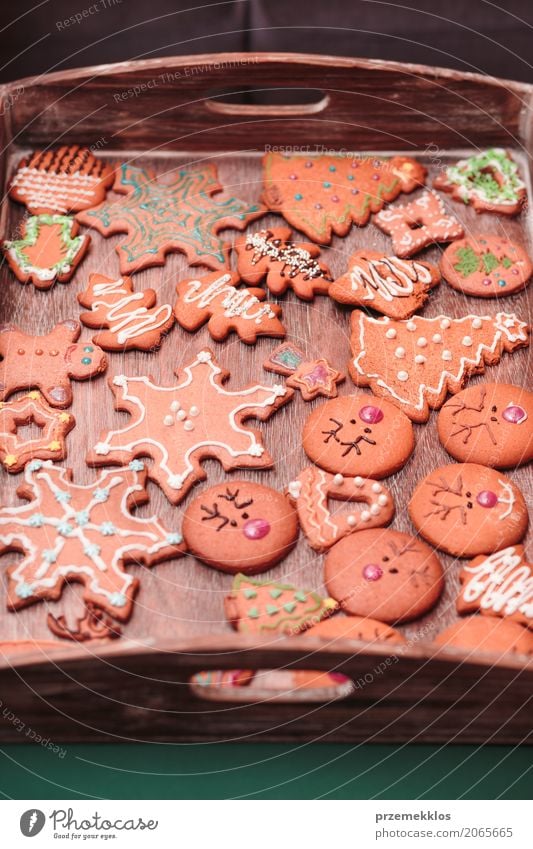 Christmas cookies decorated with frosting on wooden board Food Candy Decoration Table Feasts & Celebrations Christmas & Advent Wood Make Tradition Baking