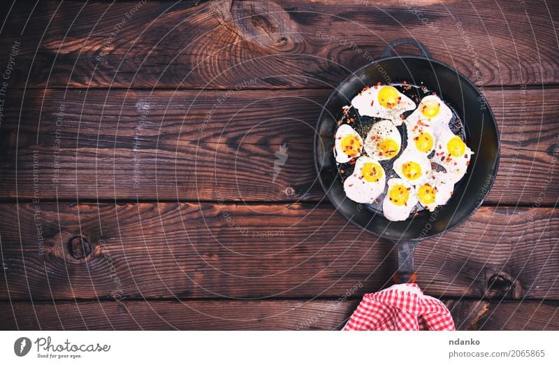 fried quail eggs Meat Herbs and spices Eating Breakfast Pan Kitchen Natural Above Retro Brown White Egg Yolk Protein frying pan Frying food cook vintage Top