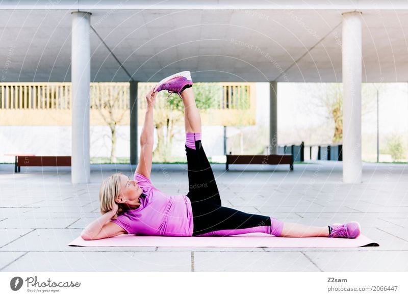 stretching Lifestyle Style Leisure and hobbies Sports Fitness Sports Training Yoga Woman Adults Female senior 60 years and older Senior citizen Town Deserted