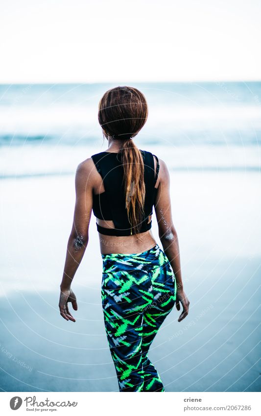 Young african woman eating potato fries in restaurant Lifestyle Wellness Relaxation Meditation Beach Ocean Sports Human being Feminine Young woman