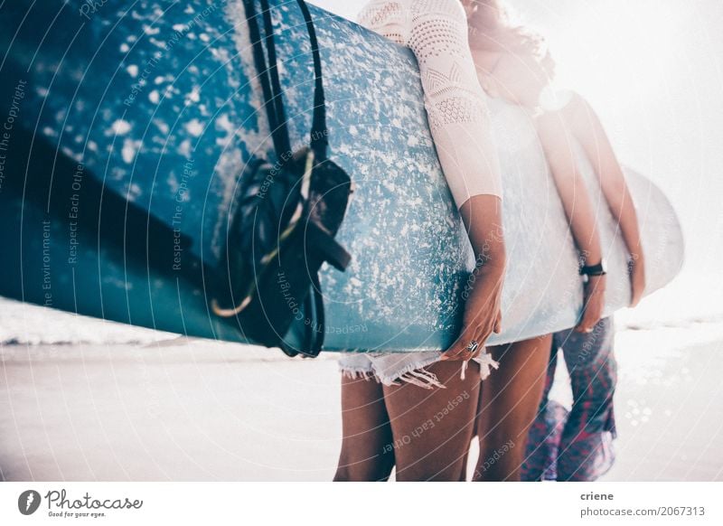 Group of girls holding surfboard on beach Lifestyle Joy Leisure and hobbies Adventure Summer Summer vacation Sun Sunbathing Beach Ocean Sports Feminine Woman