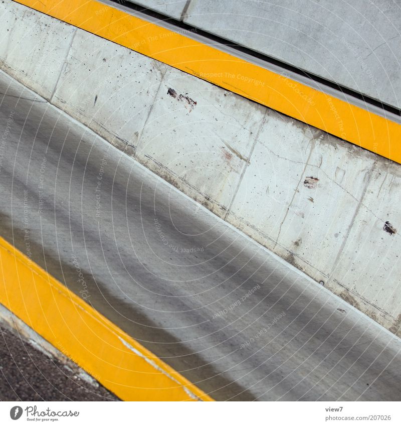 departure Wall (barrier) Wall (building) Street Stone Concrete Sign Line Stripe Esthetic Thin Authentic Simple Yellow Arrangement Perspective Precision Pure