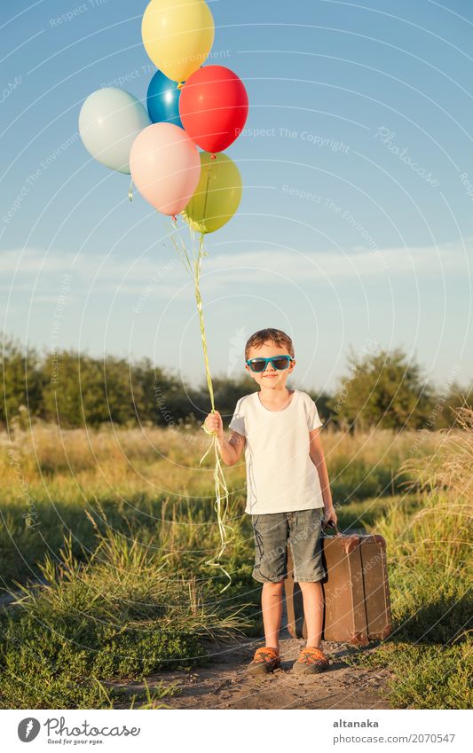 Happy little boy playing on road Lifestyle Joy Leisure and hobbies Playing Vacation & Travel Trip Adventure Freedom Camping Summer Sun Hiking Child Human being