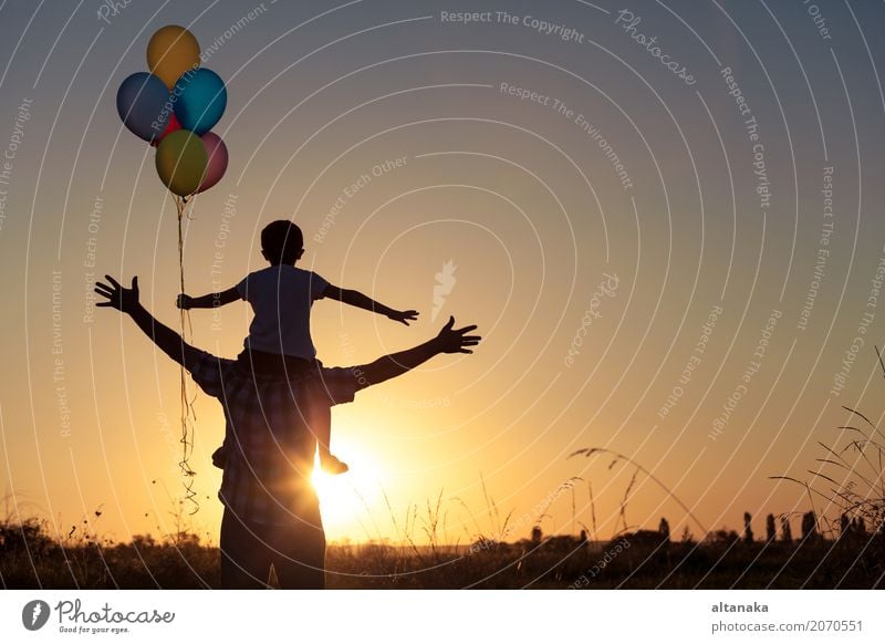 Father and son playing with balloons in the park Lifestyle Joy Happy Leisure and hobbies Vacation & Travel Adventure Freedom Camping Summer Sun Hiking Sports