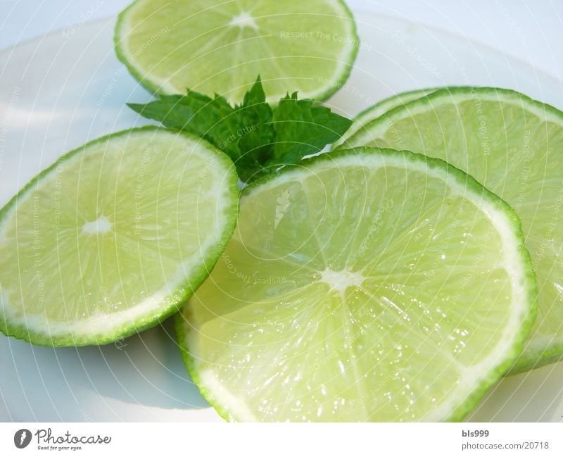 Limes on the way into a drink Drink ingredient Healthy Macro (Extreme close-up) Window pane caipirinia ingredient Tropical fruits