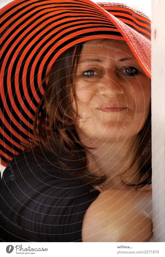 Portrait of a smiling mature woman with red striped hat | Summer Joy Happy Human being Feminine Woman Adults Life Face Hat Brunette Smiling Friendliness