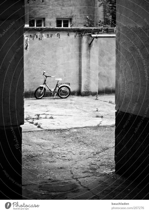 playground Bicycle Vienna Deserted Wall (barrier) Wall (building) Facade Interior courtyard Courtyard Kiddy bike Environment Black & white photo Exterior shot