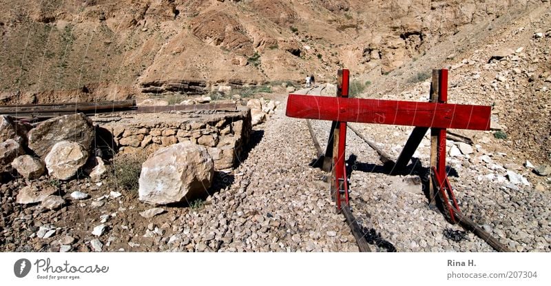 STOP! Tunisia Traffic infrastructure Rail transport Authentic Hot Bright Dry Brown Red Destruction Stop Railroad tracks Ecological disaster Rock Gravel