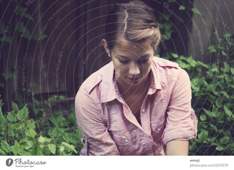 LOVED Feminine Youth (Young adults) 1 Human being Sit Dream Contentment Shirt Colour photo Exterior shot Day Upper body Downward 18 - 30 years Young woman Part