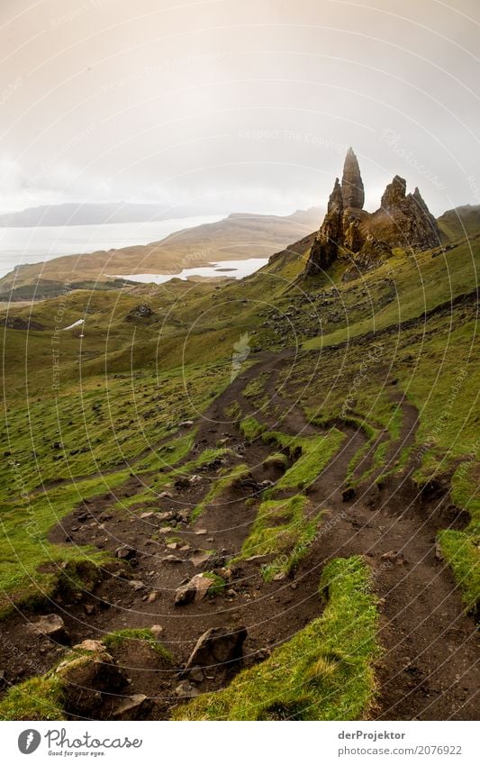 Old Man of Storr on Isle of Skye IV Clouds Ledge coast Lakeside River bank Summer Landscape Rock Bay Plant Fjord Island Scotland Europe Exterior shot