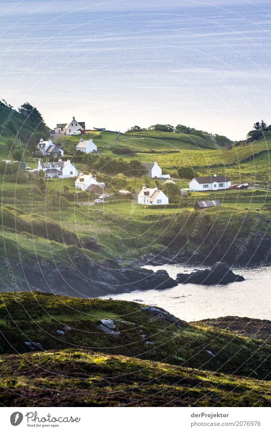 Village in the morning on Isle of Skye Clouds Ledge coast Lakeside River bank Summer Landscape Rock Bay Plant Fjord Island Scotland Europe Exterior shot