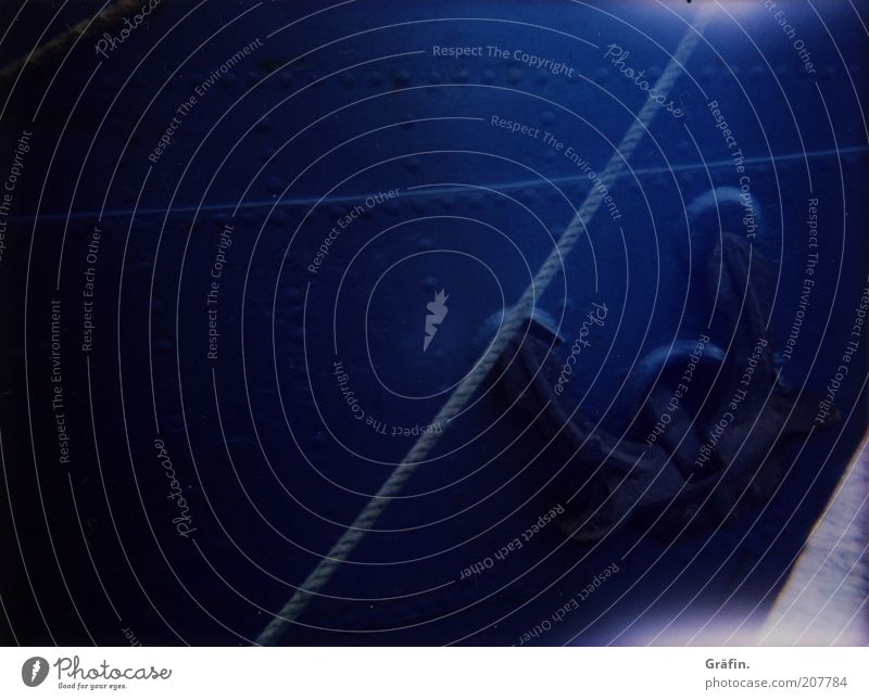 Anchoring Passenger ship Steamer Metal Steel Old To swing Dark Blue Shaft of light Rope Rivet Colour photo Exterior shot Lomography Polaroid Day Ship's side