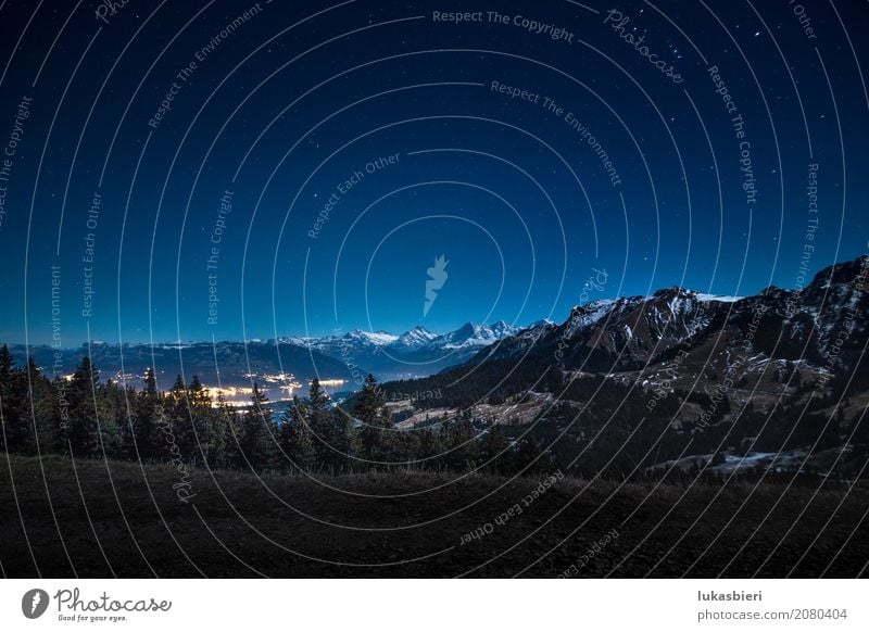 Night shot with a view of the snowy mountains and Lake Thun Environment Nature Landscape Sky Stars Autumn Winter Beautiful weather Fog Snow Snowcapped peak