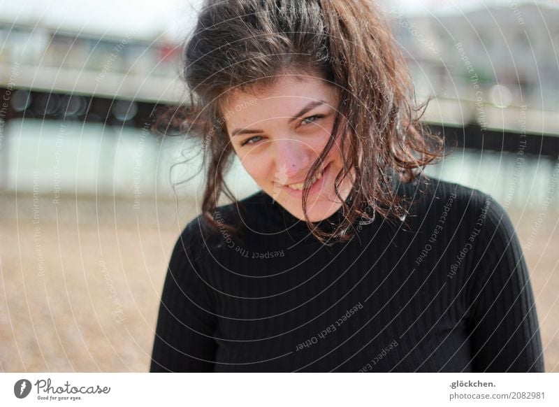 On the beach. Human being Young woman Youth (Young adults) Hair and hairstyles 1 18 - 30 years Adults Sand Beach Brighton Sweater Black-haired Long-haired