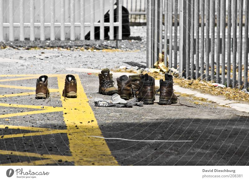 Day1 - Day14 = Dry shoes Summer Stockings Leather Footwear Boots Hiking boots Yellow Gray Laced boot Grating Fence Metal Parking lot In pairs Colour photo