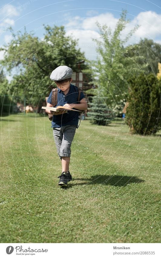 reading Masculine Child Toddler Boy (child) Infancy Life 1 Human being Sky Summer Beautiful weather Garden Park Meadow Hat Cap Beret Think Walking Study Smart