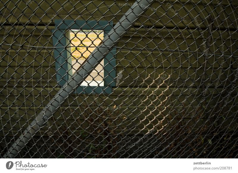 PC - the unknown addiction Summer Old Fence Wire netting fence Border Hollow Window Hatch Vista Safety Divide Passage Sunlight Shaft of light Colour photo