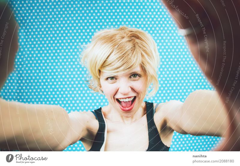 Young cheerful woman taking a self-portrait Lifestyle Party Human being Feminine Young woman Youth (Young adults) 1 18 - 30 years Adults Camera Photography