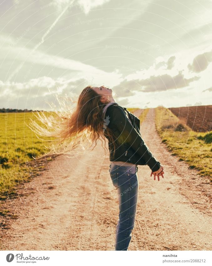 Young woman enjoying the sunset with wind blowing her hair Lifestyle Style Joy Healthy Wellness Summer Sun Human being Feminine Youth (Young adults) 1