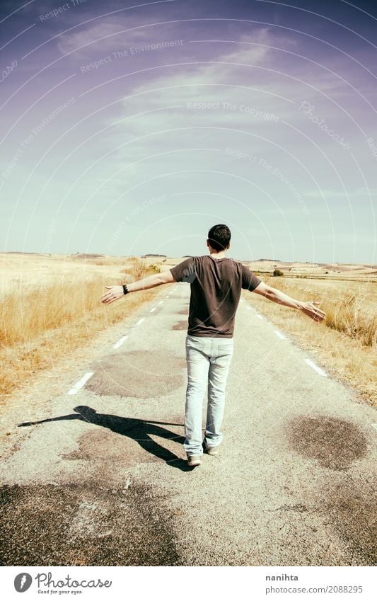 Young man walking a old road Lifestyle Joy Happy Healthy Athletic Wellness Calm Vacation & Travel Tourism Adventure Far-off places Freedom Summer