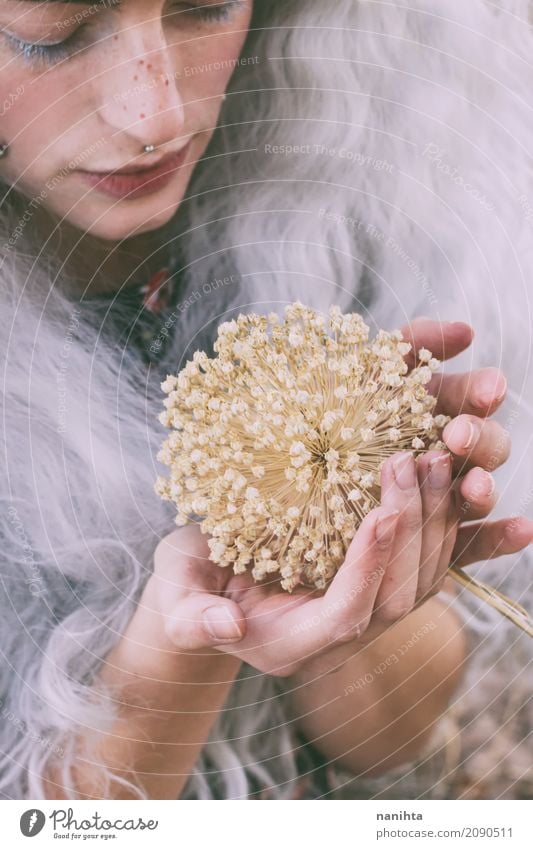 Young different woman touching a dry flower Human being Feminine Young woman Youth (Young adults) 1 18 - 30 years Adults Nature Plant Autumn Blossom Piercing