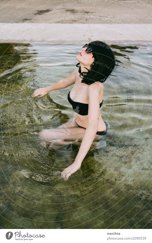 Young woman enjoying a bath in a natural pool at summer Lifestyle Elegant Style Body Swimming pool Vacation & Travel Tourism Trip Freedom Summer Summer vacation