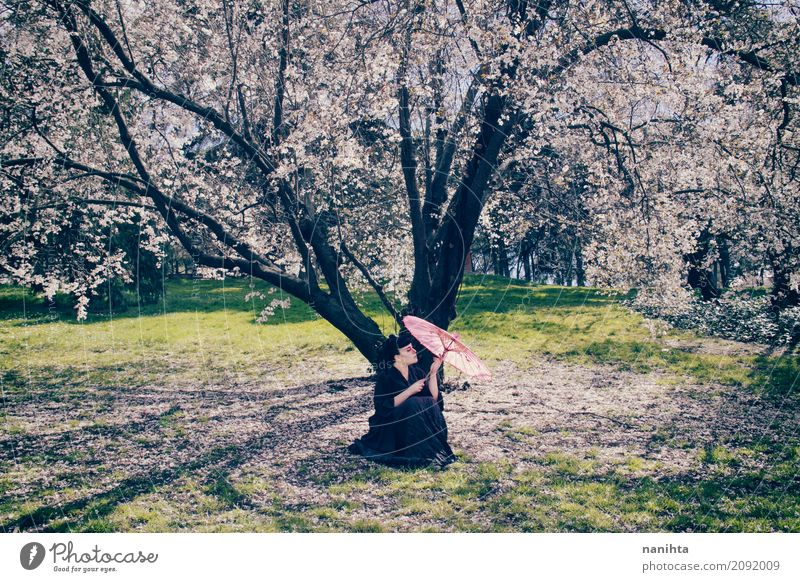 Woman with an umbrella under a beautiful blossoming tree Elegant Style Exotic Human being Feminine Young man Youth (Young adults) 1 18 - 30 years Adults