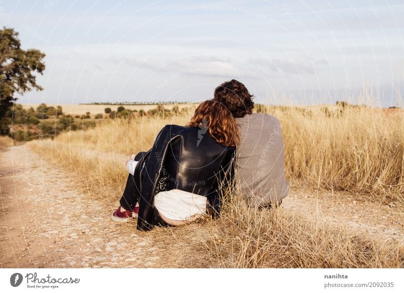 Back view of a young couple in a rural path Lifestyle Joy Human being Masculine Feminine Young woman Youth (Young adults) Young man Family & Relations