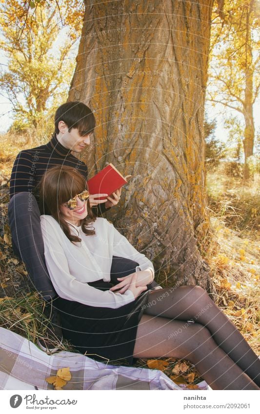 Young couple enjoying a sunny day outdoors Lifestyle Joy Wellness Harmonious Well-being Leisure and hobbies Reading Vacation & Travel Tourism Freedom Expedition