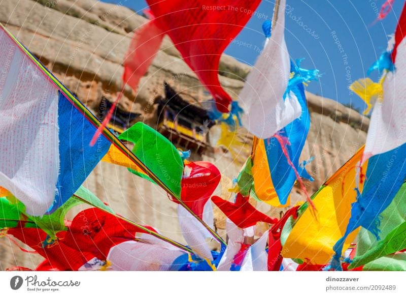 Mati Si temple with colorful praying flags, China Meditation Vacation & Travel Tourism Culture Rock Building Architecture Monument Flag Old Historic Red