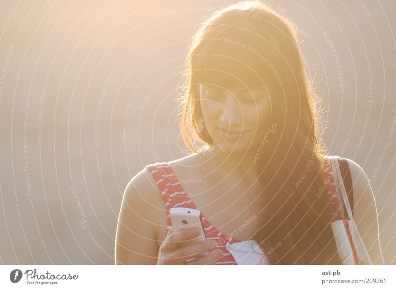 pleasant sms Freedom Telephone Cellphone Screen Telecommunications Human being Young woman Youth (Young adults) Woman Adults 1 Reading Looking Positive Emotions