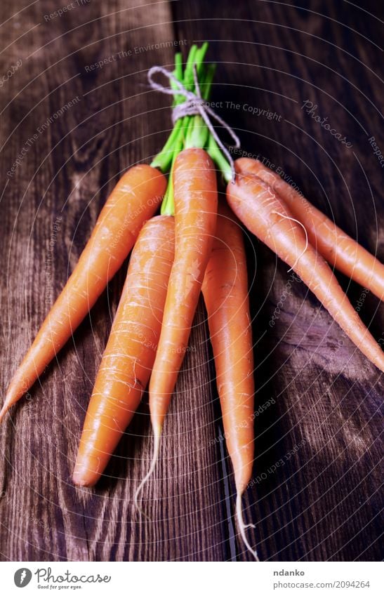 Fresh carrots Vegetable Nutrition Eating Vegetarian diet Diet Table Nature Plant Leaf Wood Natural Green ripe Useful agriculture iron Organic orange Salad Tasty