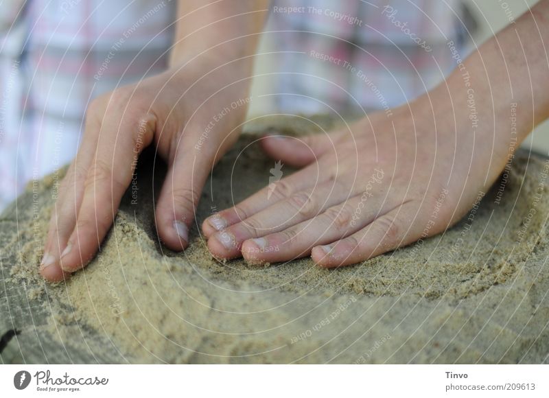 sand cake Leisure and hobbies Playing Infancy Hand Fingers Touch Movement Creativity Structures and shapes Sand Sand cake Round Diligent Colour photo