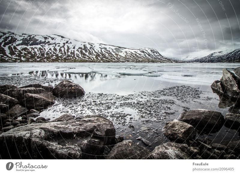 norge VI Nature Landscape Water Storm clouds Spring Winter Mountain Glacier Lake Norway Scandinavia Jotunheimen Dark Fluid Cold Wet Gloomy Brown Gray Turquoise