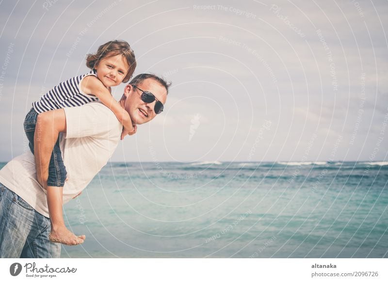 Happy father and son playing on the beach Lifestyle Joy Relaxation Leisure and hobbies Playing Vacation & Travel Trip Freedom Summer Sun Beach Ocean Child