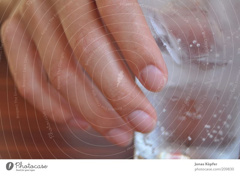 a hand and a glass Beverage Cold drink Drinking water Glass Feminine Hand Fingers To enjoy Thirst Colour photo Interior shot Close-up Detail Day Blur Front view