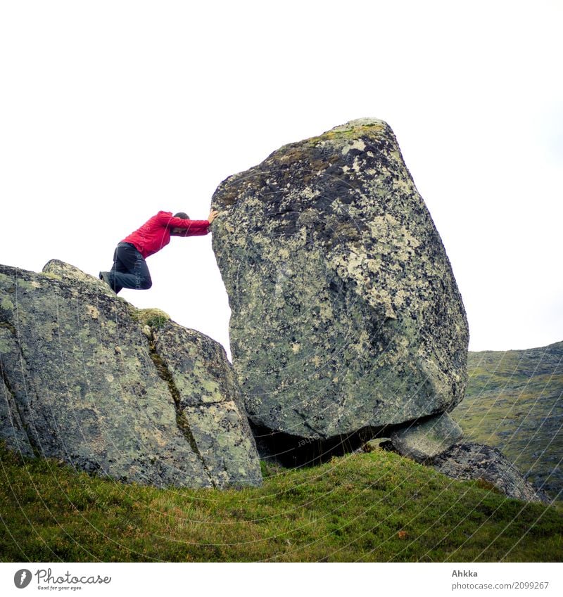 Young man takes up big challenge Adventure Human being Masculine 1 Nature Climate change Rock Movement Green Red Bravery Optimism Power Willpower Determination