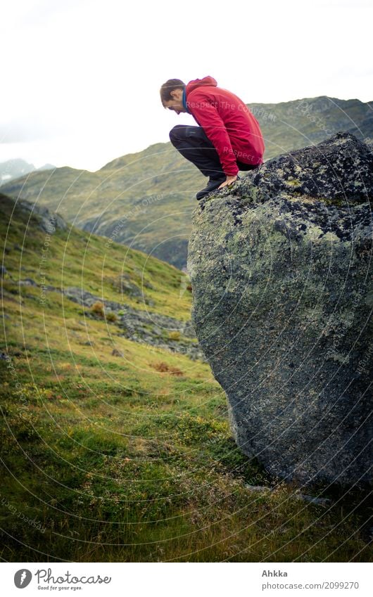 Young man facing a challenge Playing Vacation & Travel Adventure Youth (Young adults) Nature Grass Rock Scandinavia Discover To hold on Bravery Self-confident