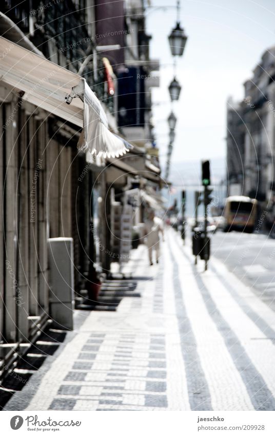 Midday in Lisbon Portugal Town Capital city Port City Downtown Old town Pedestrian precinct Deserted Transport Road traffic Street Sidewalk Hot Bright Moody