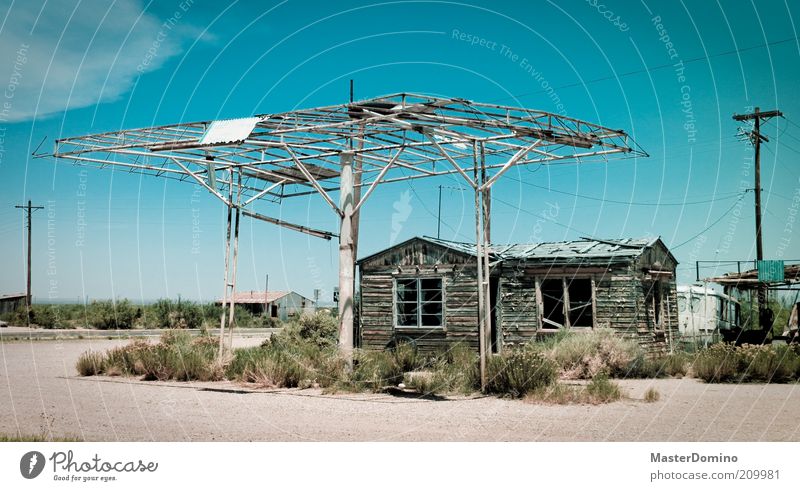 ghost town Earth Sand Sky Summer Climate Warmth Bushes USA Village Hut Petrol station Old Dirty Historic Loneliness Poverty Fiasco Environmental pollution Past