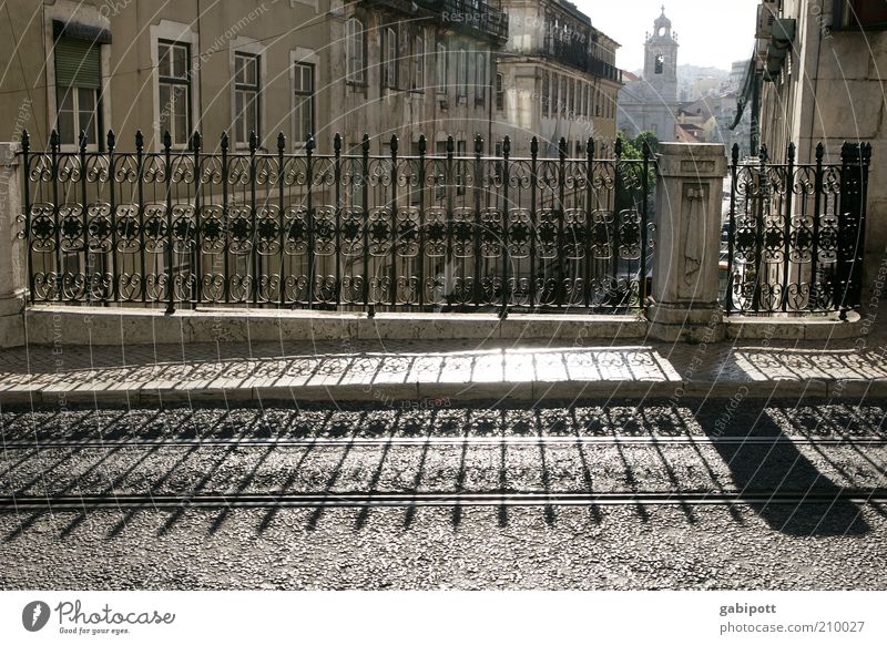 Lisbon early evening Downtown Old town Street Lanes & trails Bridge railing Shadow Shadow play Historic Town Joie de vivre (Vitality) Stagnating Symmetry