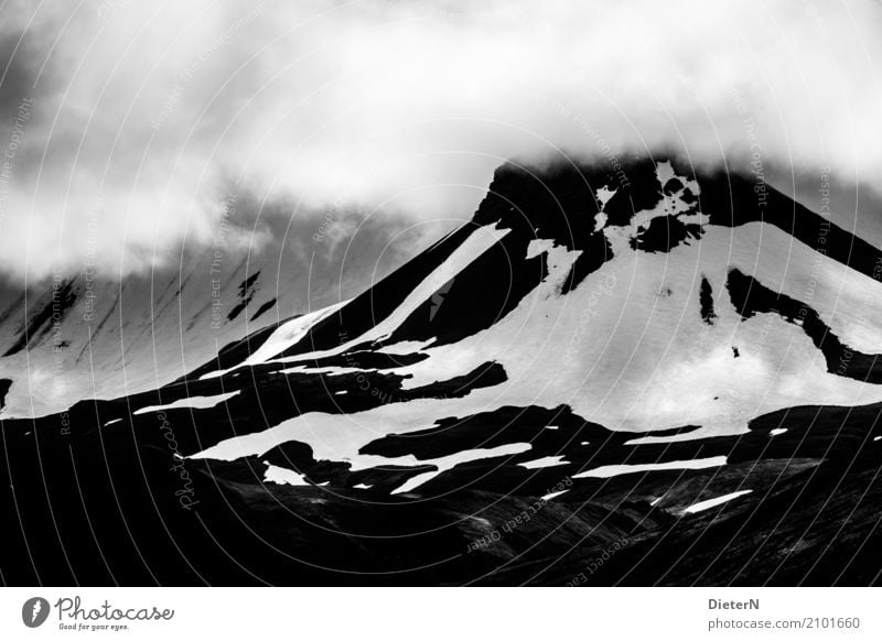 Mountain and valley Environment Nature Landscape Air Clouds Climate Weather Bad weather Rock Peak Snowcapped peak Glacier Gray Black White Iceland