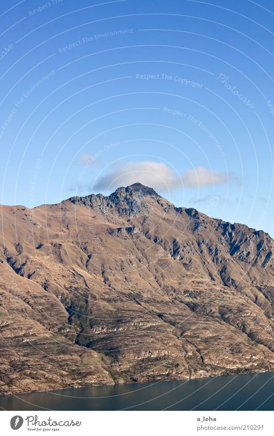 Top of the hill Landscape Elements Air Water Sky Clouds Beautiful weather Rock Mountain Peak Lakeside Ocean Relaxation Firm Large Tall Cold Wanderlust