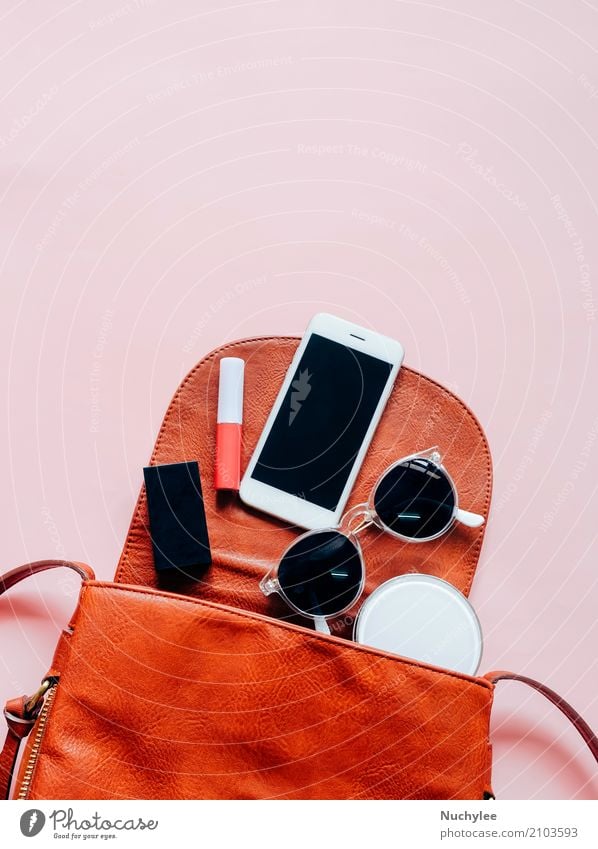 Flat lay of leather woman bag Elegant Style Design Beautiful Skin Make-up Lipstick Vacation & Travel Telephone PDA Technology Feminine Woman Adults Hand Fashion