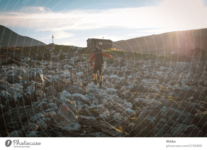 Stony road to a hut in Scandinavia Vacation & Travel Adventure Hiking Sportsperson Young man Youth (Young adults) Nature Hill Rock Norway Hut Sharp-edged Many