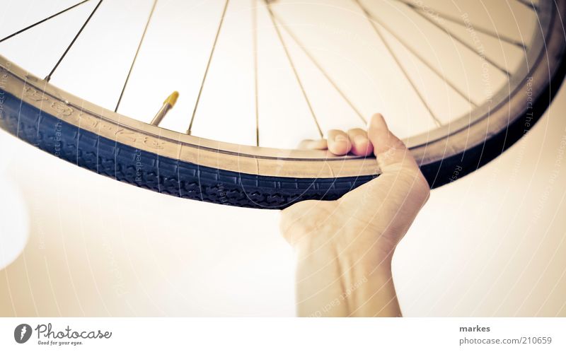 a wheel... hooray! Hand Metal Plastic To hold on Blue Yellow Black White Joy Enthusiasm Determination Power Wheel Spokes Valve Colour photo Subdued colour