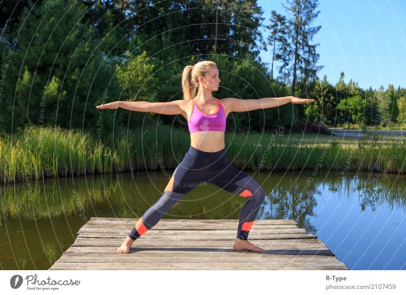 A sporty woman doing yoga and stretching exercises Lifestyle Wellness Sports Yoga Human being Woman Adults Nature Park Fashion Blonde Fitness aerobics active